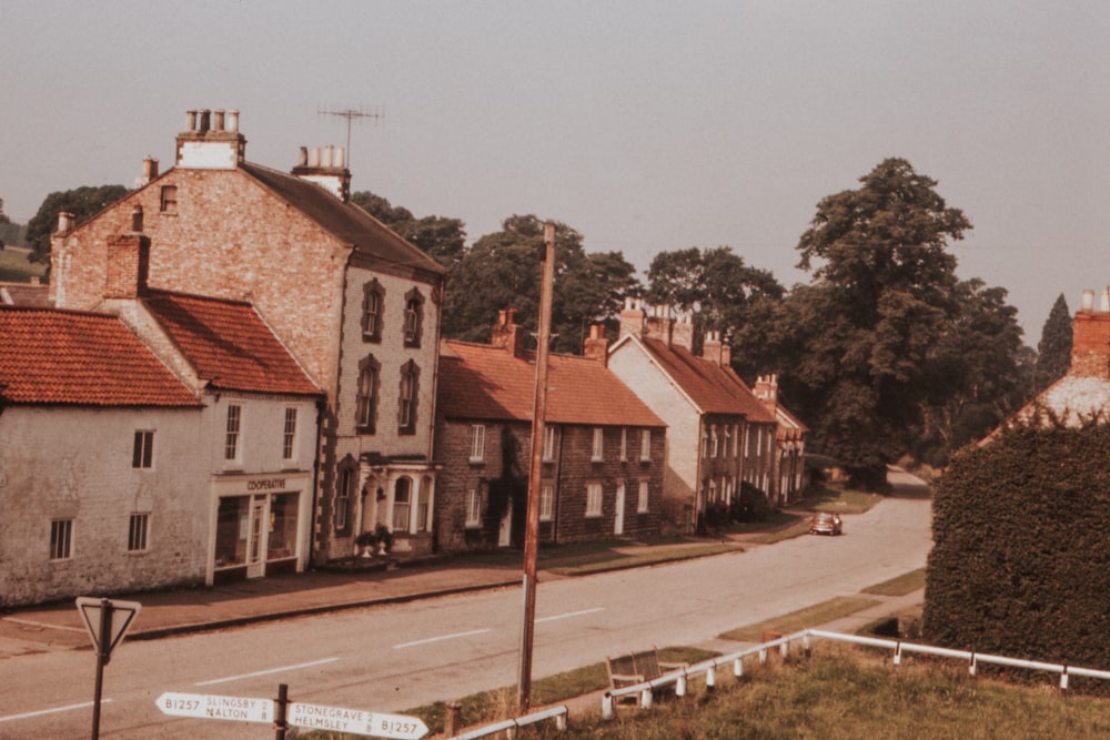 white and brown concrete buildings showing road