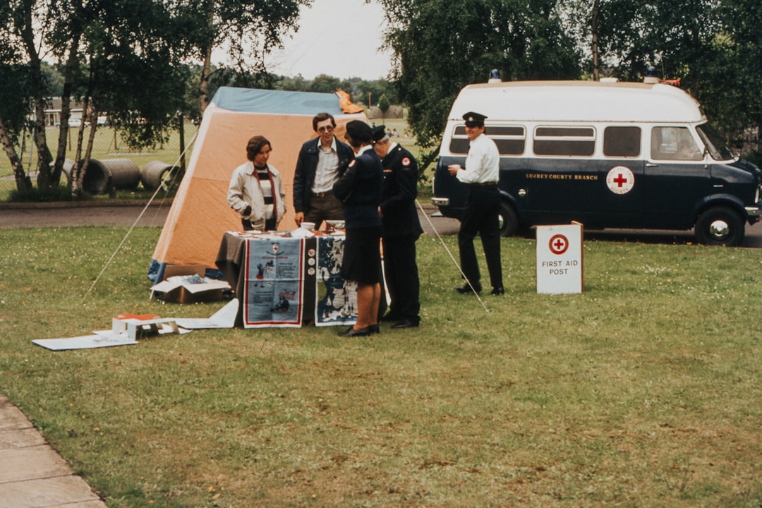 people standing near tent and van during daytime