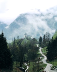 A serene landscape featuring a tranquil path leading to a mystical mountain peak.