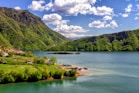 houses near body of water during daytime