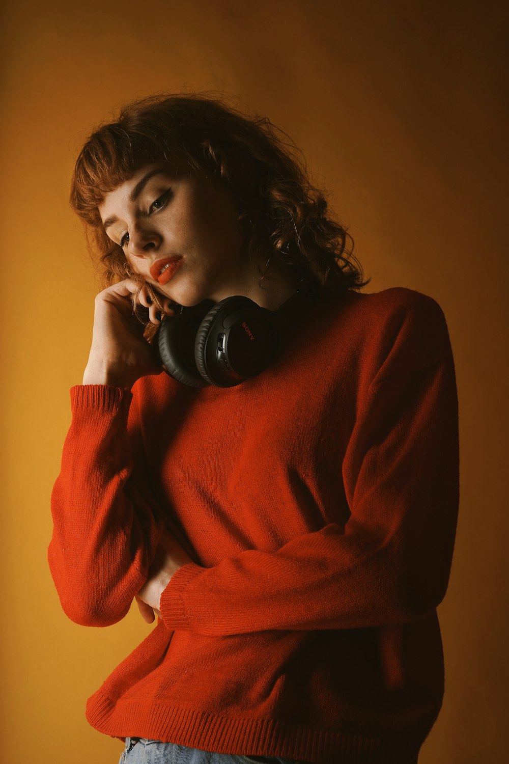 woman wearing red crew-neck sweatshirt