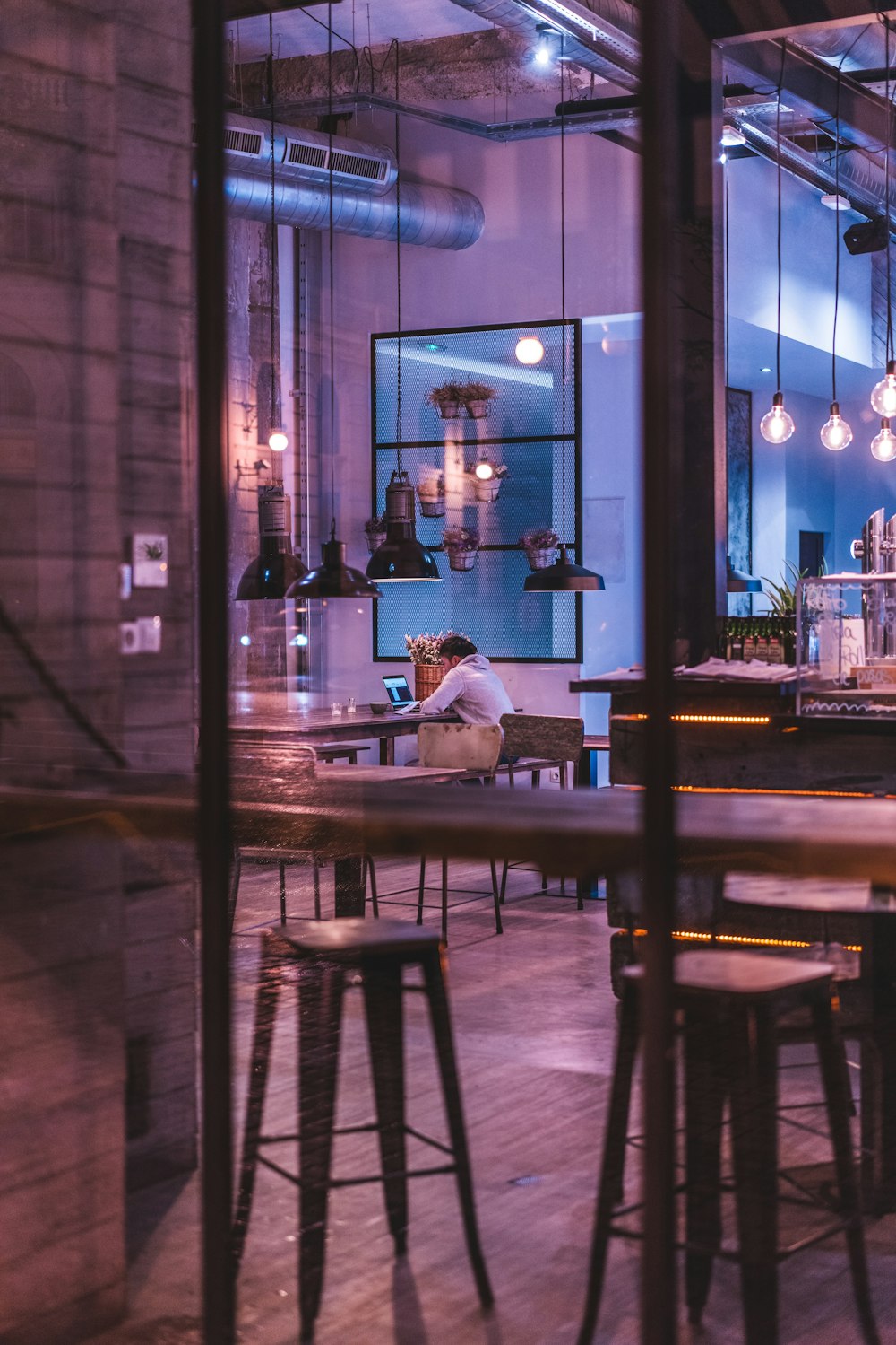 person sitting on chair near table