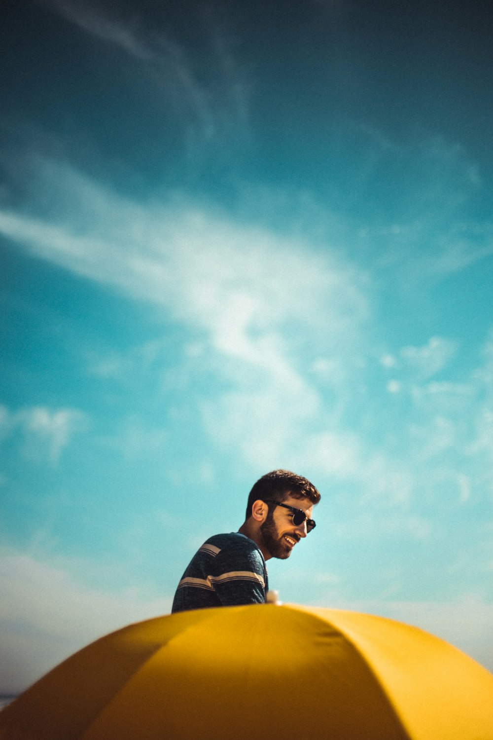 man near yellow umbrella