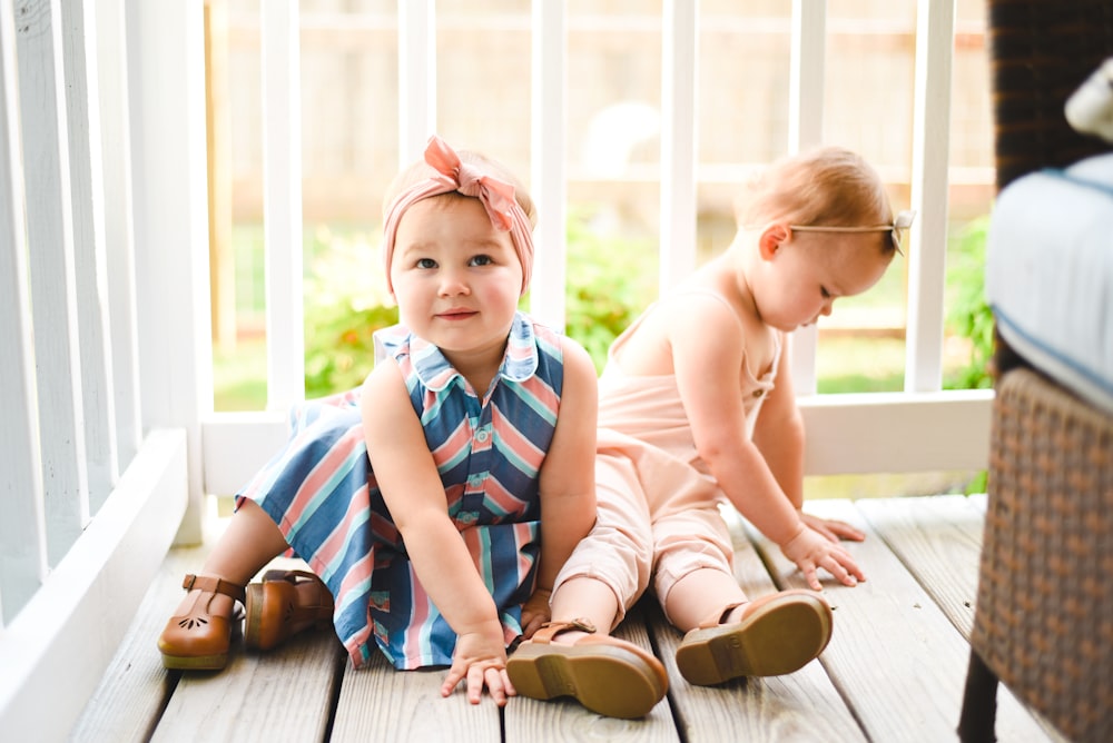 two babies on porch