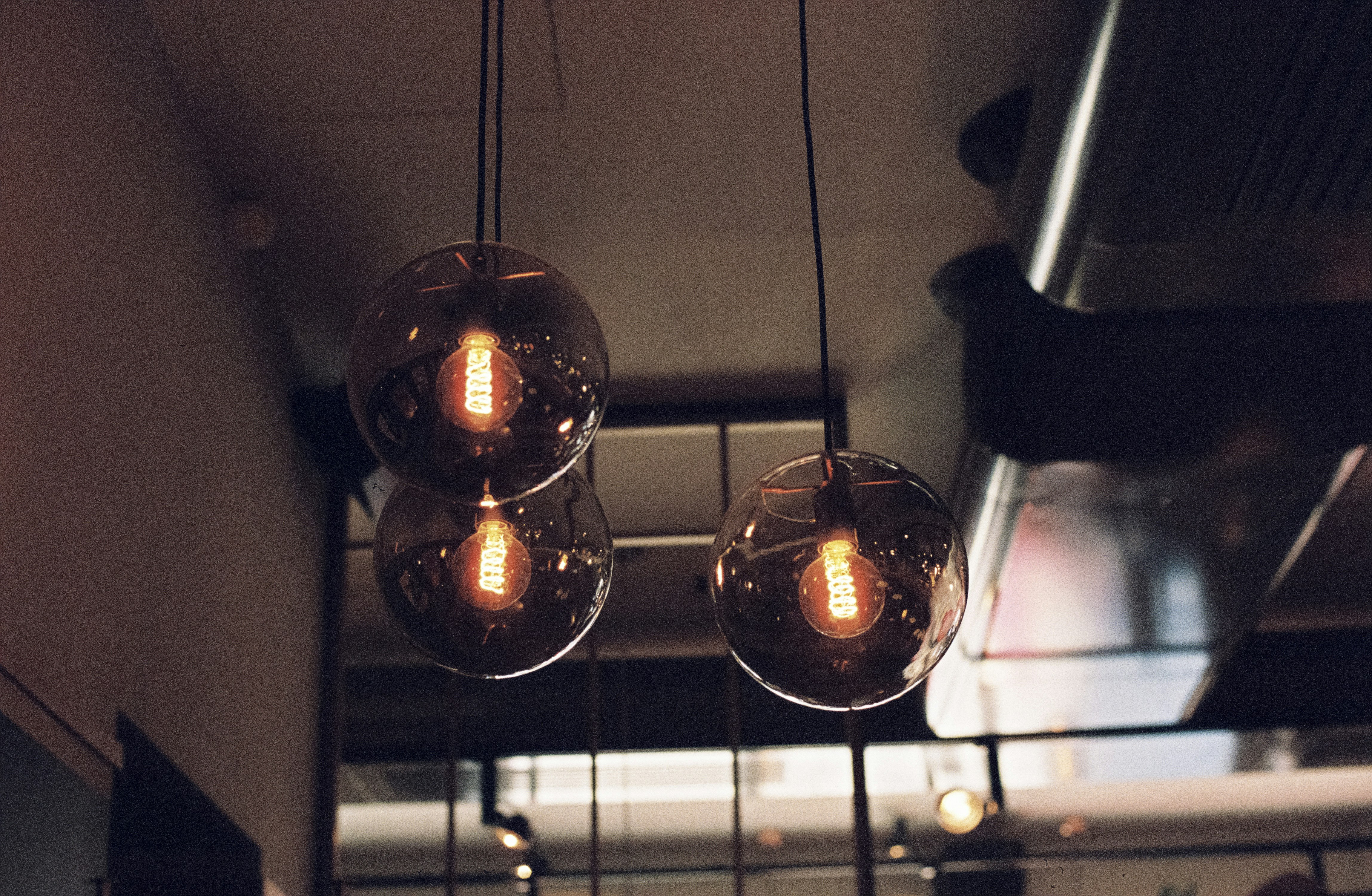 Urban hipster location interieur - vintage industrial lights. Made with Leica R7 (Year: 1994) and Leica Summilux-R 1.4 / 50mm (Year: 1983). Analog scan via meinfilmlab.de: Fuji Frontier SP-3000. Film reel: Kodak Portra 800