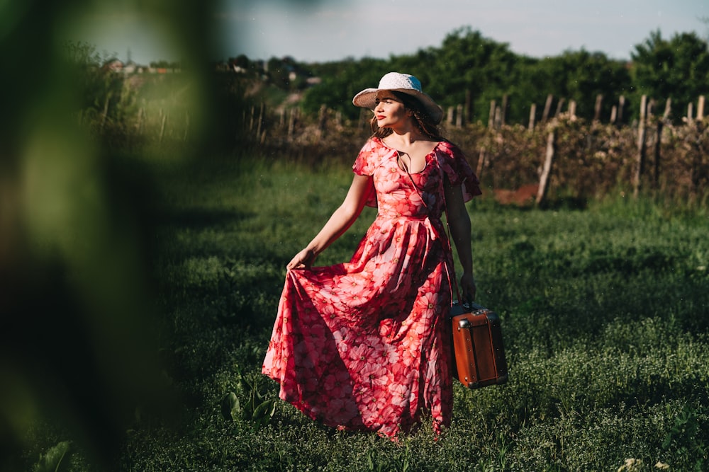 woman wearing red floral cap-sleeved maxi dress