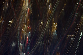 A sleek vertical video slider displaying dynamic clips with a subtle glass blur overlay.