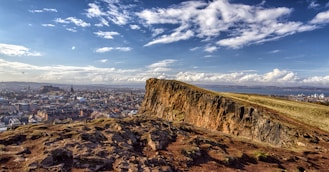 cliff near buildings during daytime