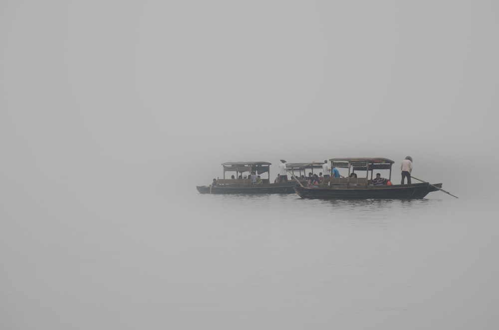 grayscale photography of passenger boat