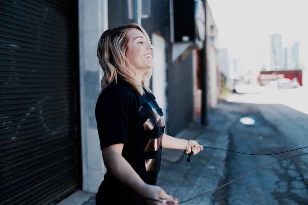 woman holding dowsing rods