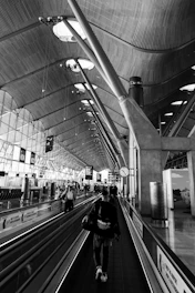 A bustling airport terminal showcasing advanced fluid engineering systems and BIM coordination.