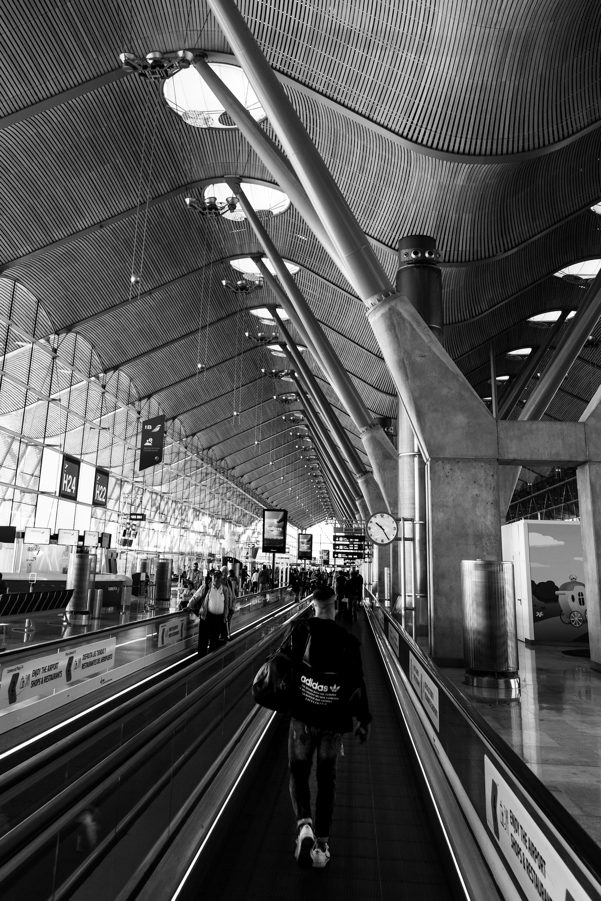 Modern airport terminal with travelers