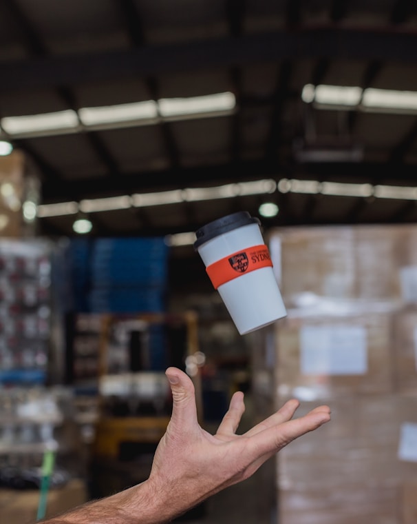 white and black plastic cup with lid