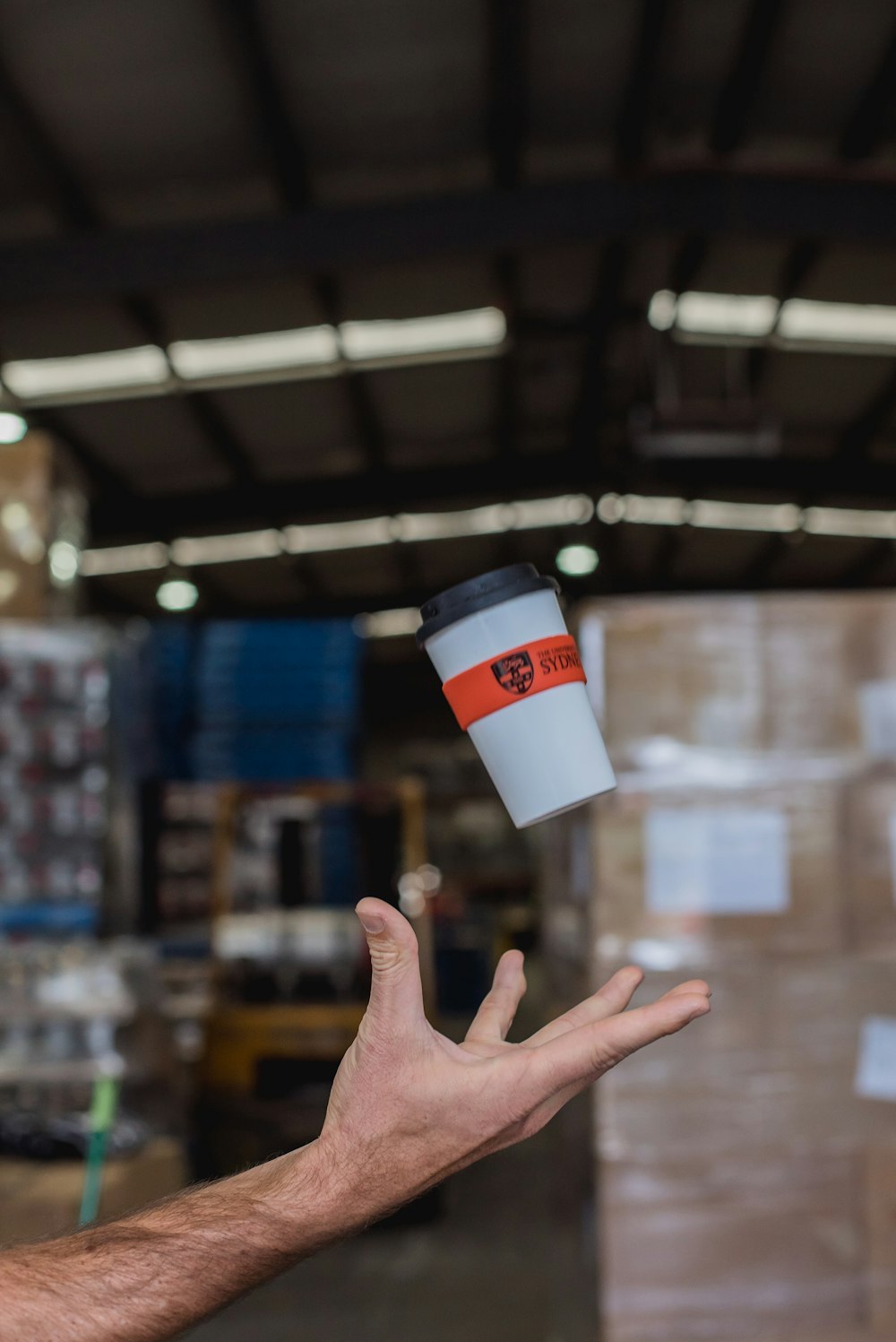 white and black plastic cup with lid