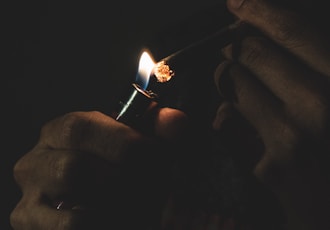 man lighting cigarette