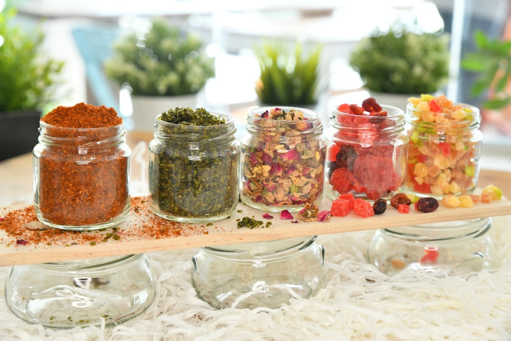 clear glass jars with spices