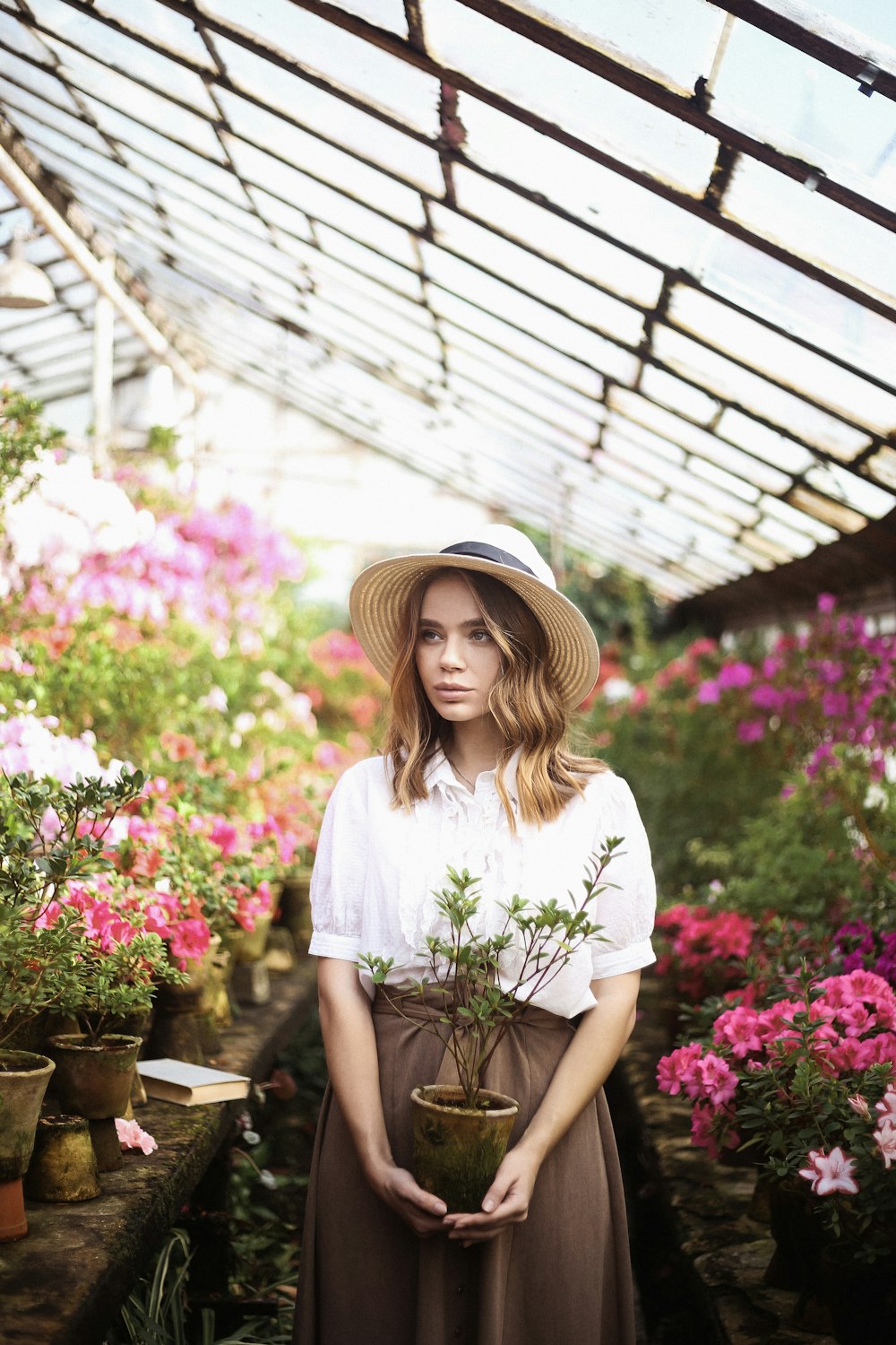 woman standing in greenhouse