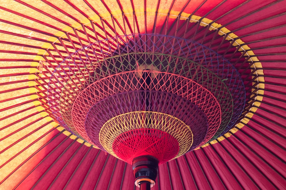 a close up of a red and yellow umbrella