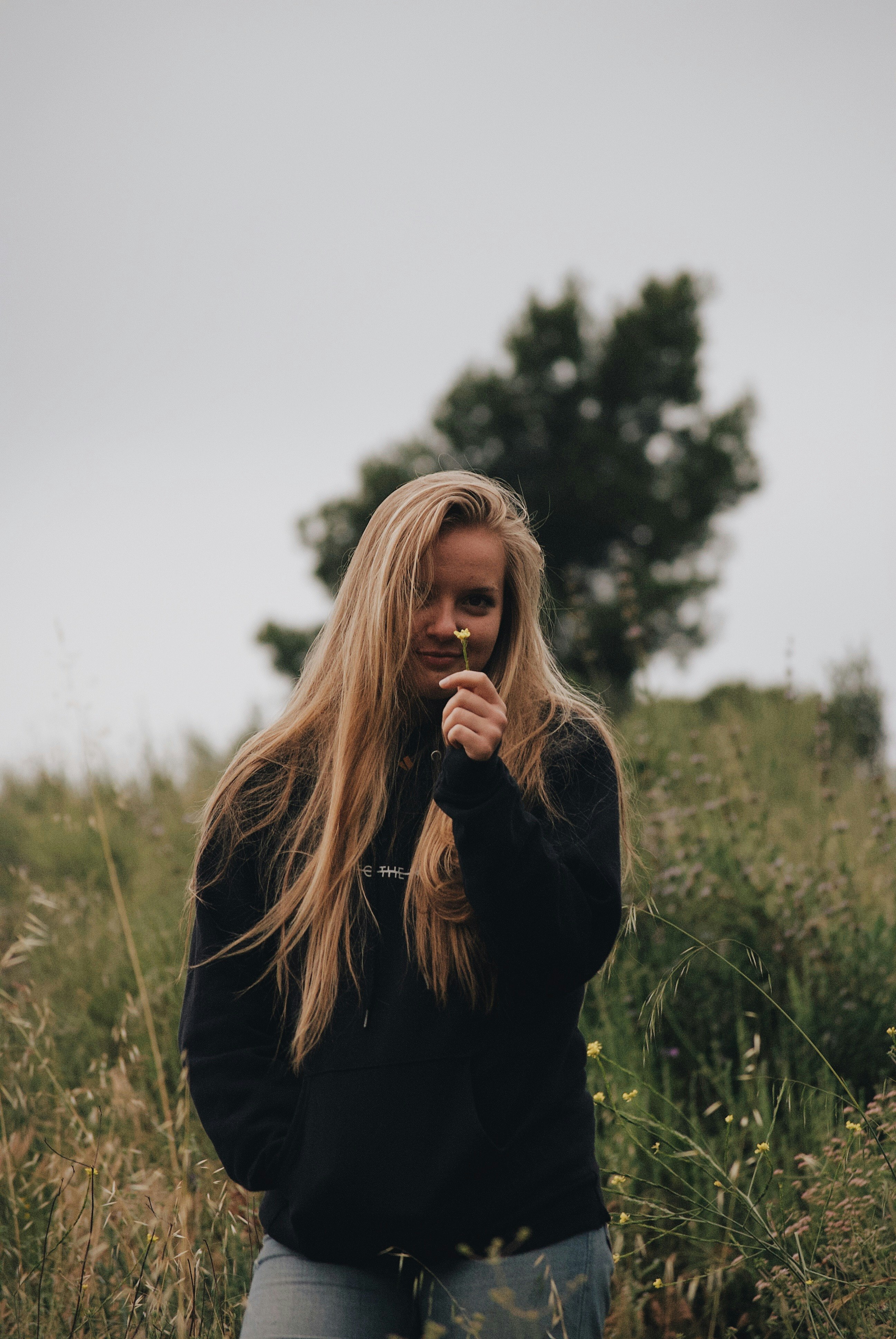 woman standing near grass