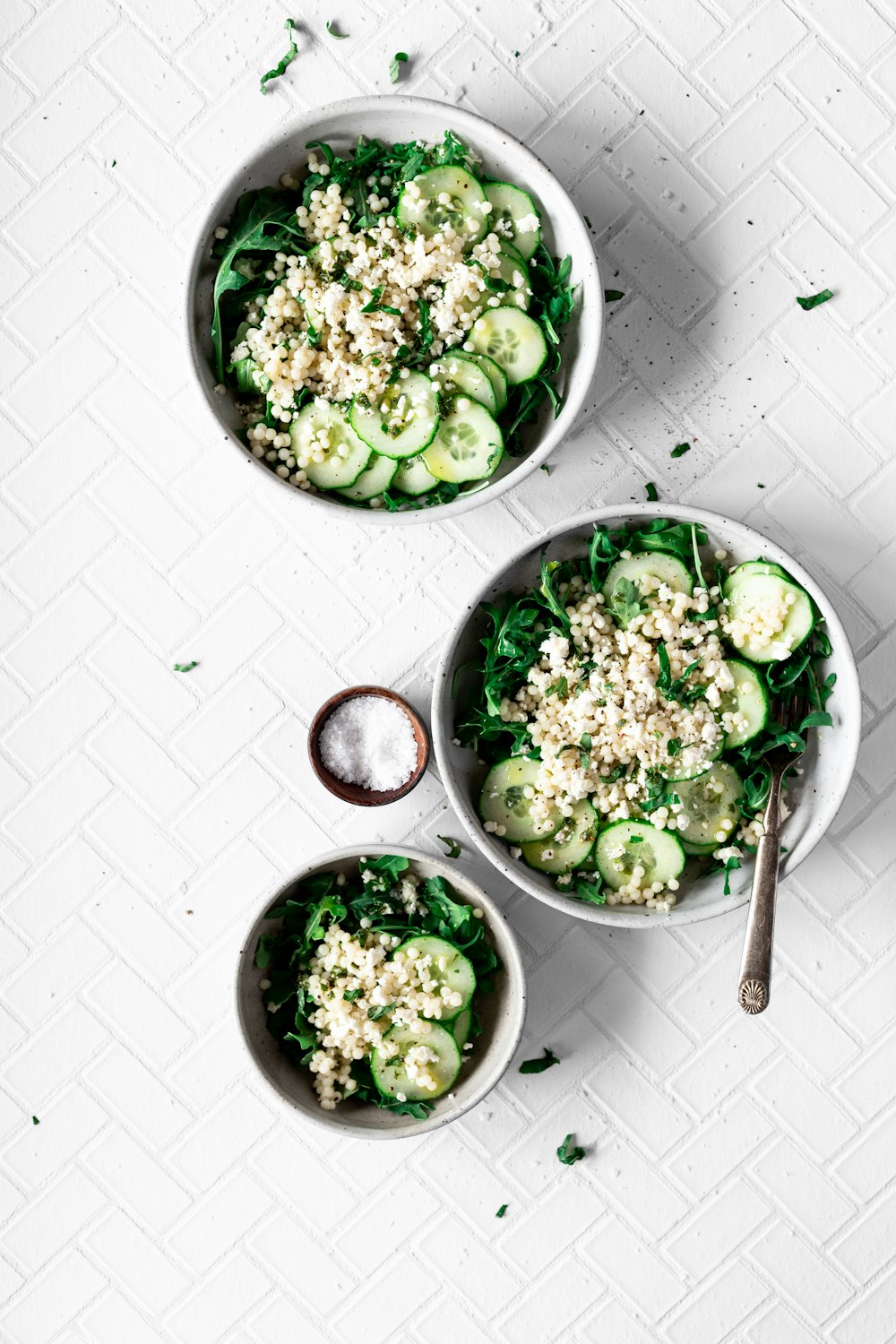 sliced cucumber in bowl close-up photography