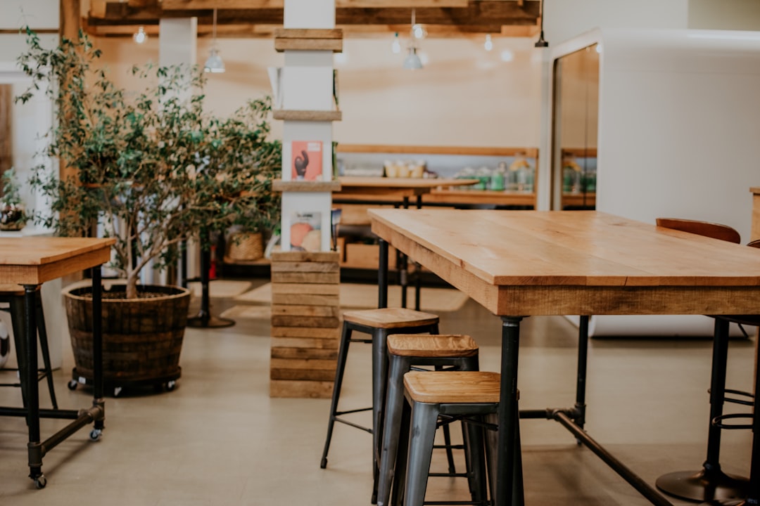 brown and black wooden table and stools, Co-working office space.