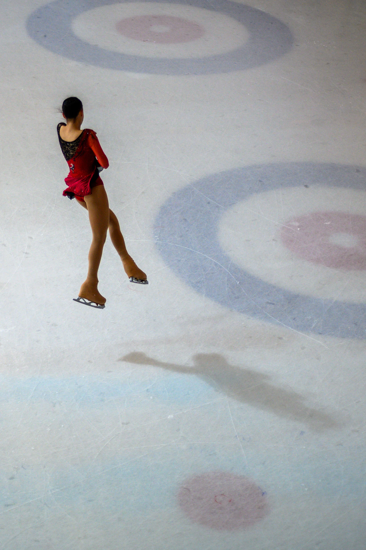 A figure skater performing on the ice during a program