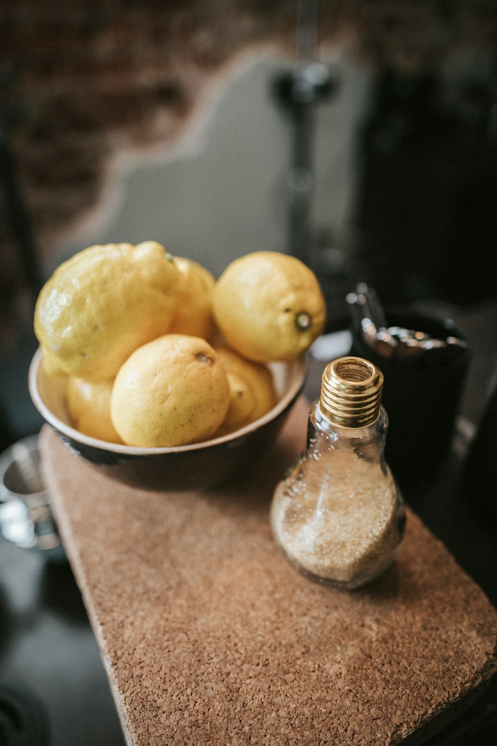 yellow lemons in white bowl