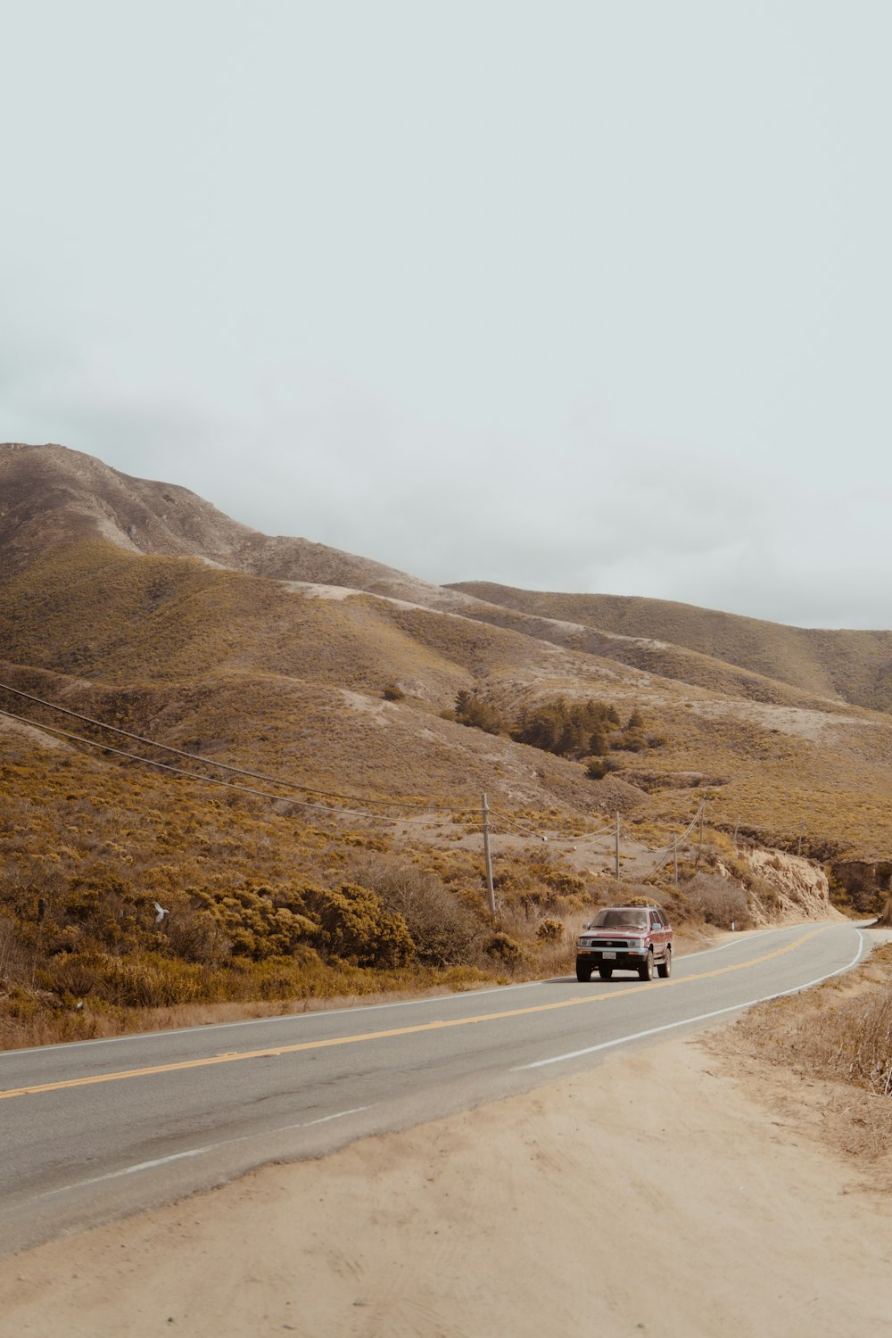 vehicle on road near mountain