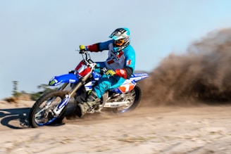 Beau Manley demonstrating advanced dirtbike control techniques amid rugged terrain.