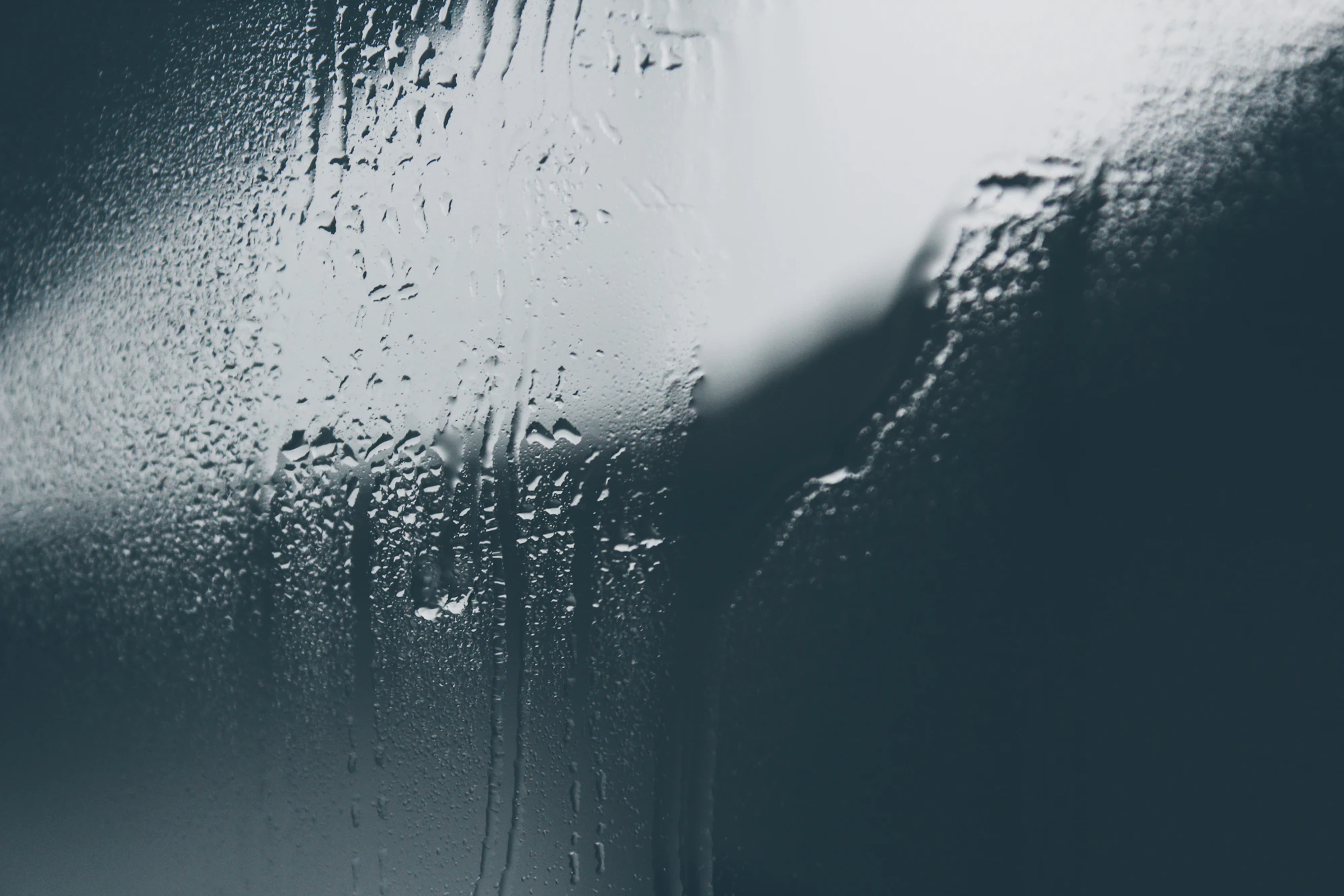 Steam and condensation on glass, close-up water texture