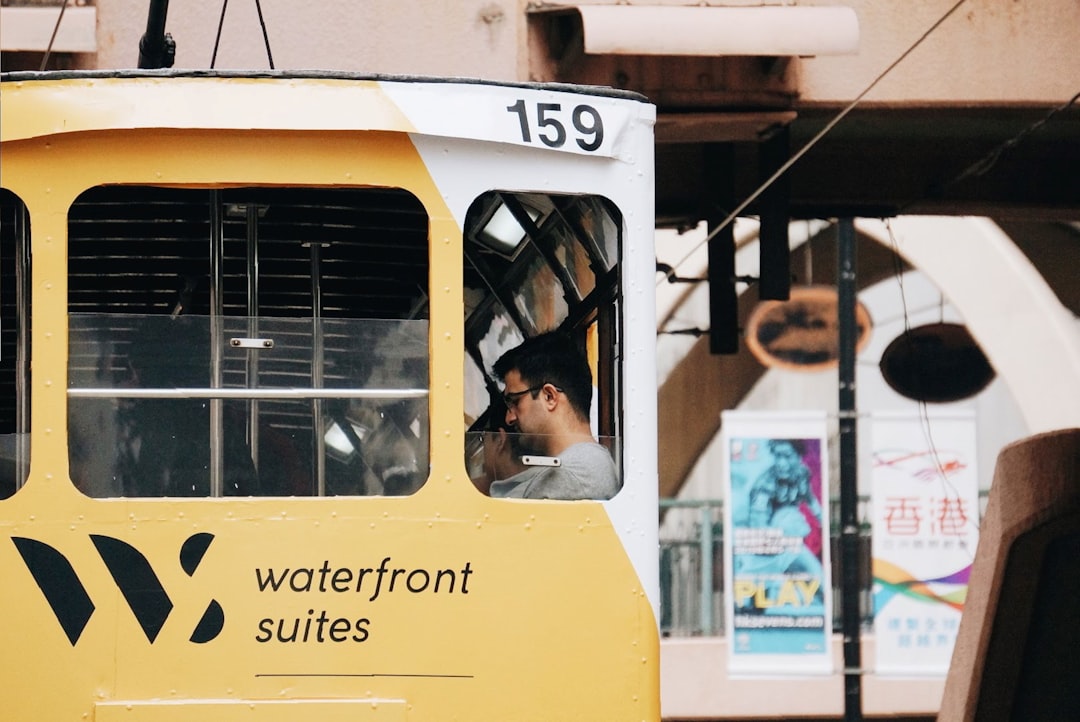 man riding in vehicle during daytime