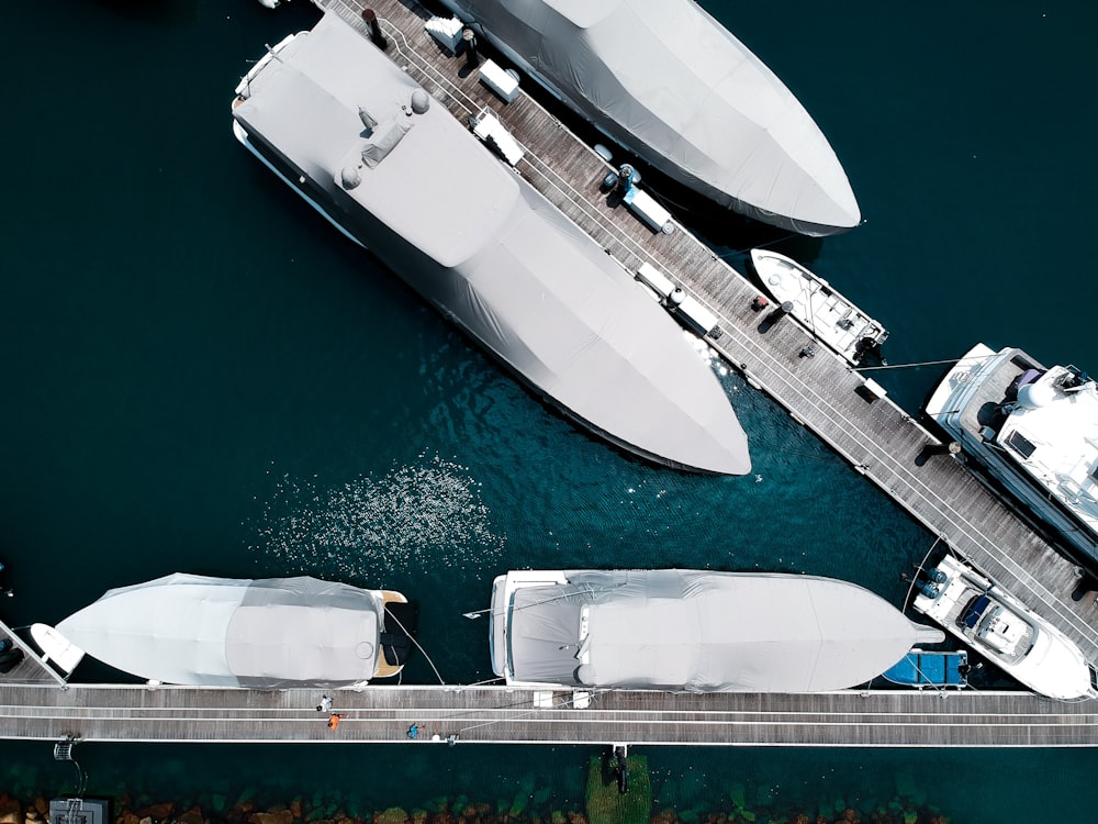 aerial photography of powerboats parked beside docks