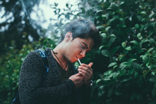 A serene morning scene with a person enjoying fresh air outdoors, symbolizing freedom from smoking.