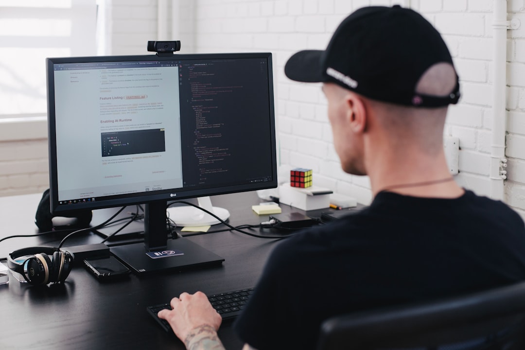 man facing the computer,