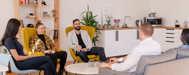 people seated in living room