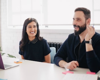 two person smiling during daytime