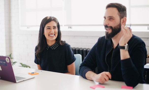 two person smiling during daytime