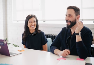 two person smiling during daytime