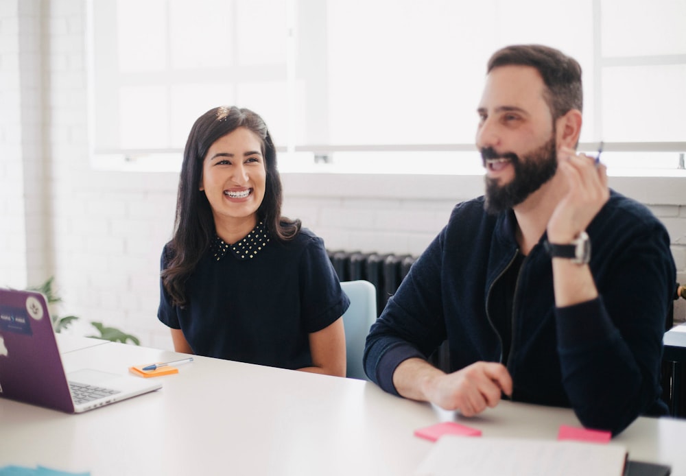 two person smiling during daytime