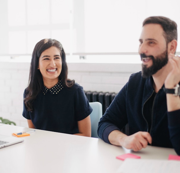 two person smiling during daytime