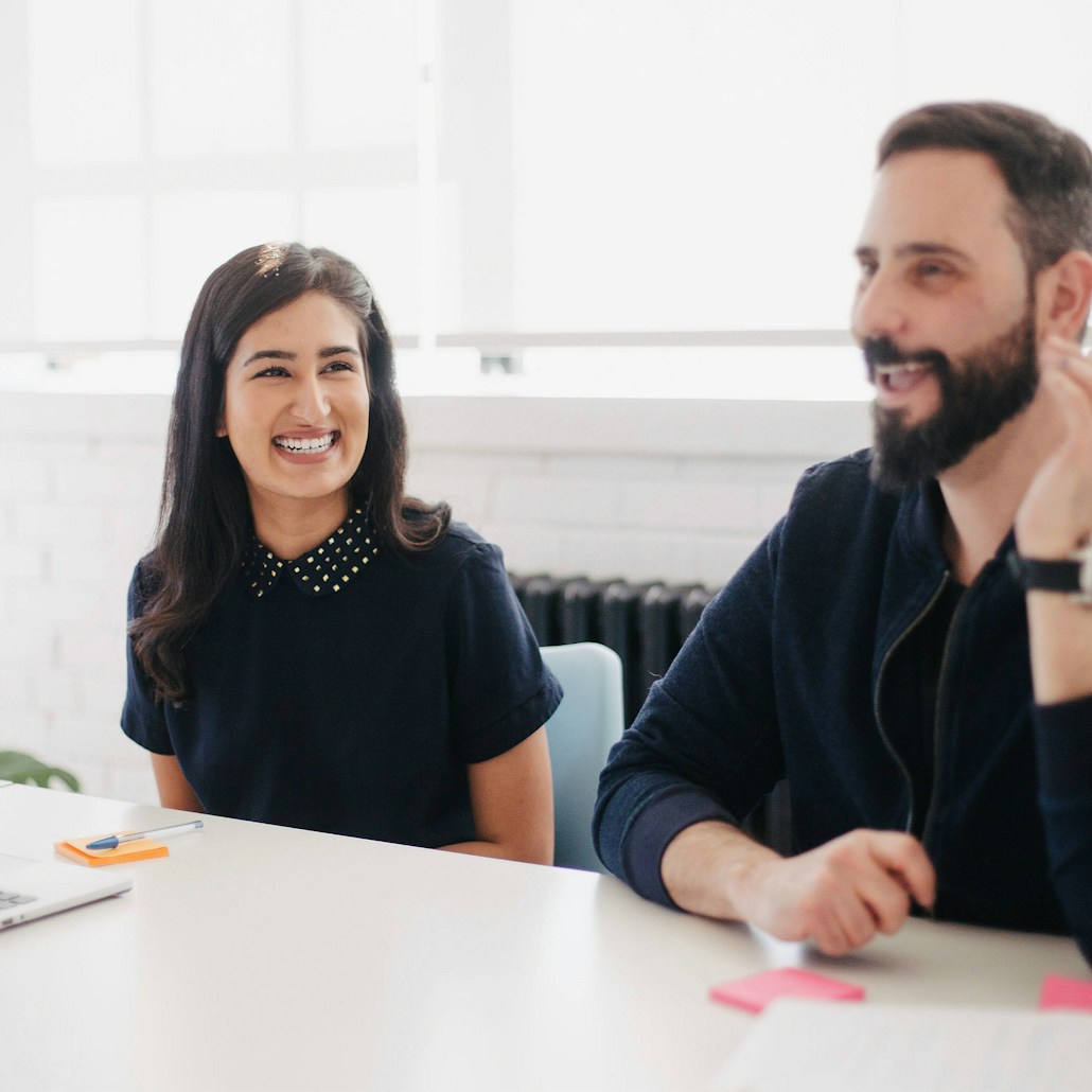 two person smiling during daytime