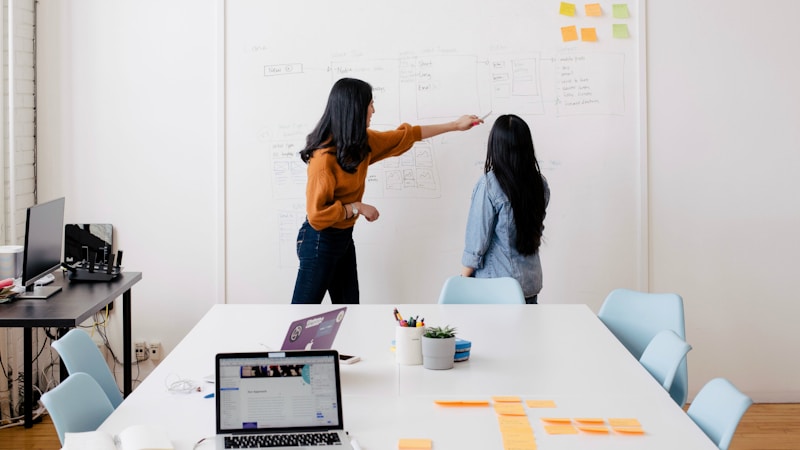 Two women working in an office.