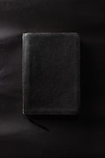 Close-up of the ebook cover 'already free' with amber accents on a dark background.