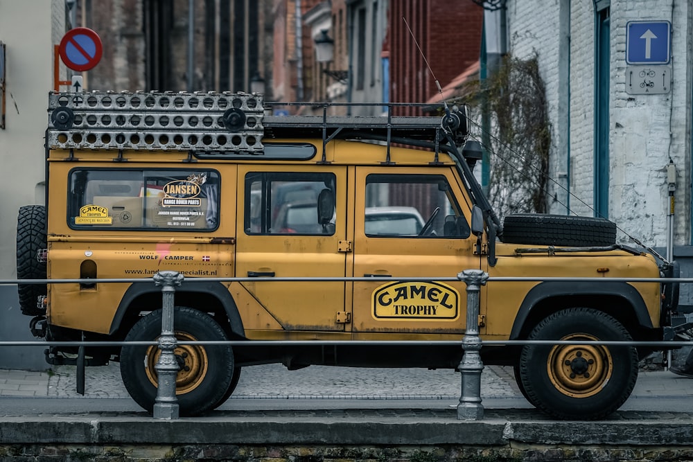 yellow vehicle parked near building