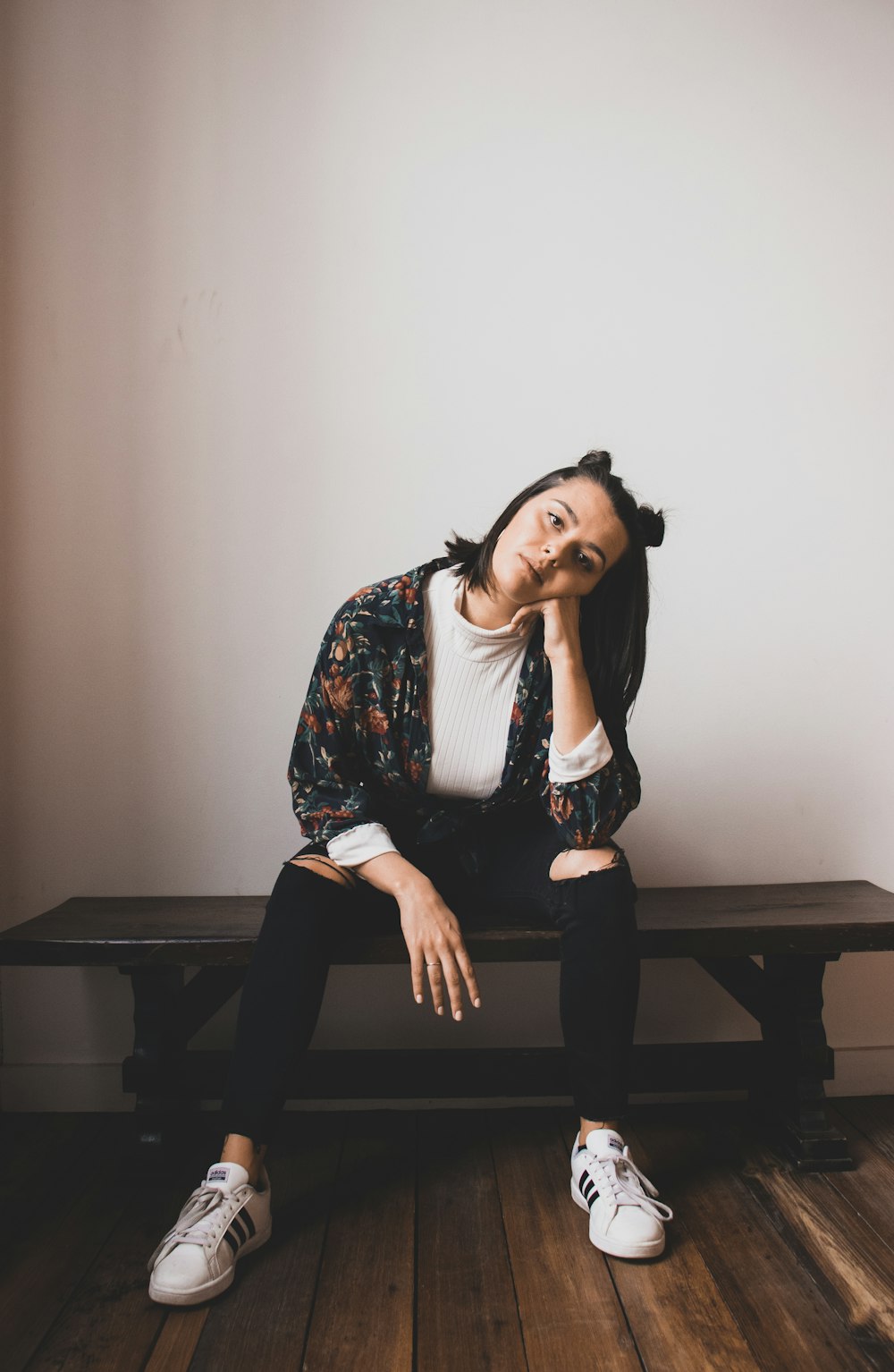 woman sitting on wooden bench