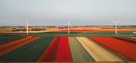 high-angle photography of three wind mills