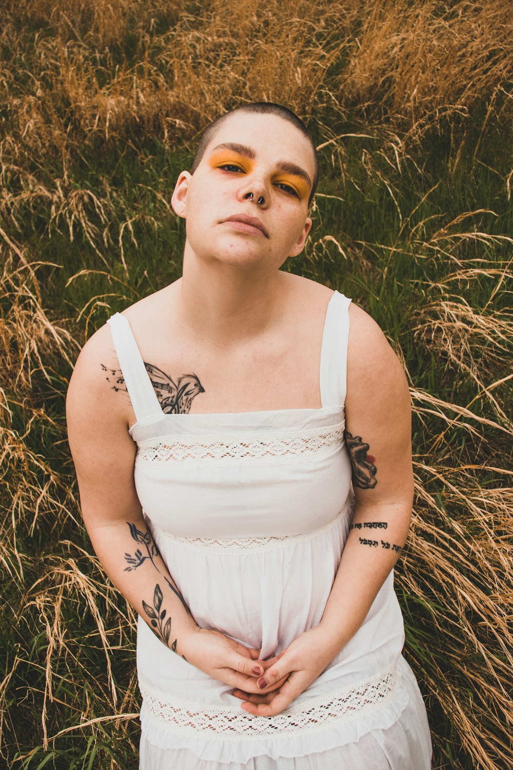 woman wearing white spaghetti strap dress