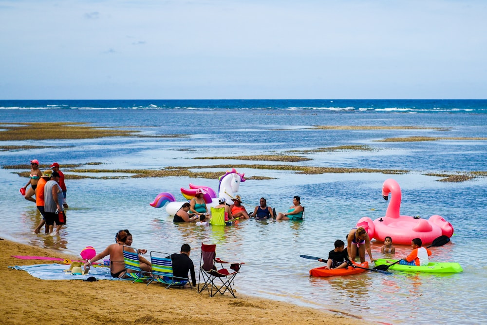 inflatable flamingo floating on blue beach