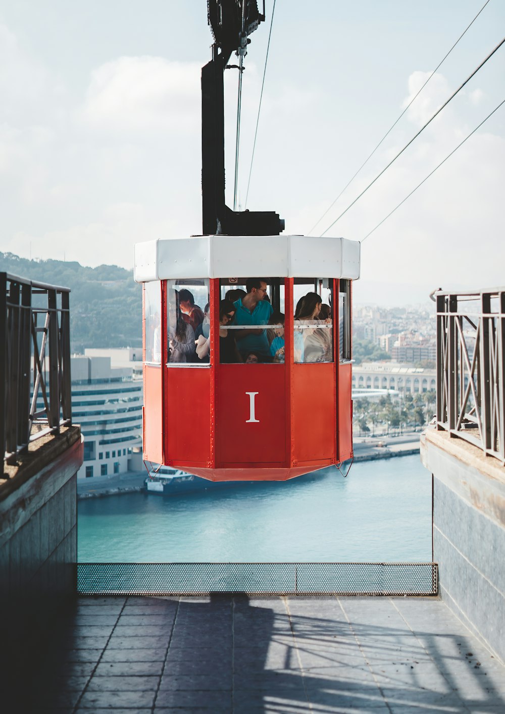 people riding on cable cart