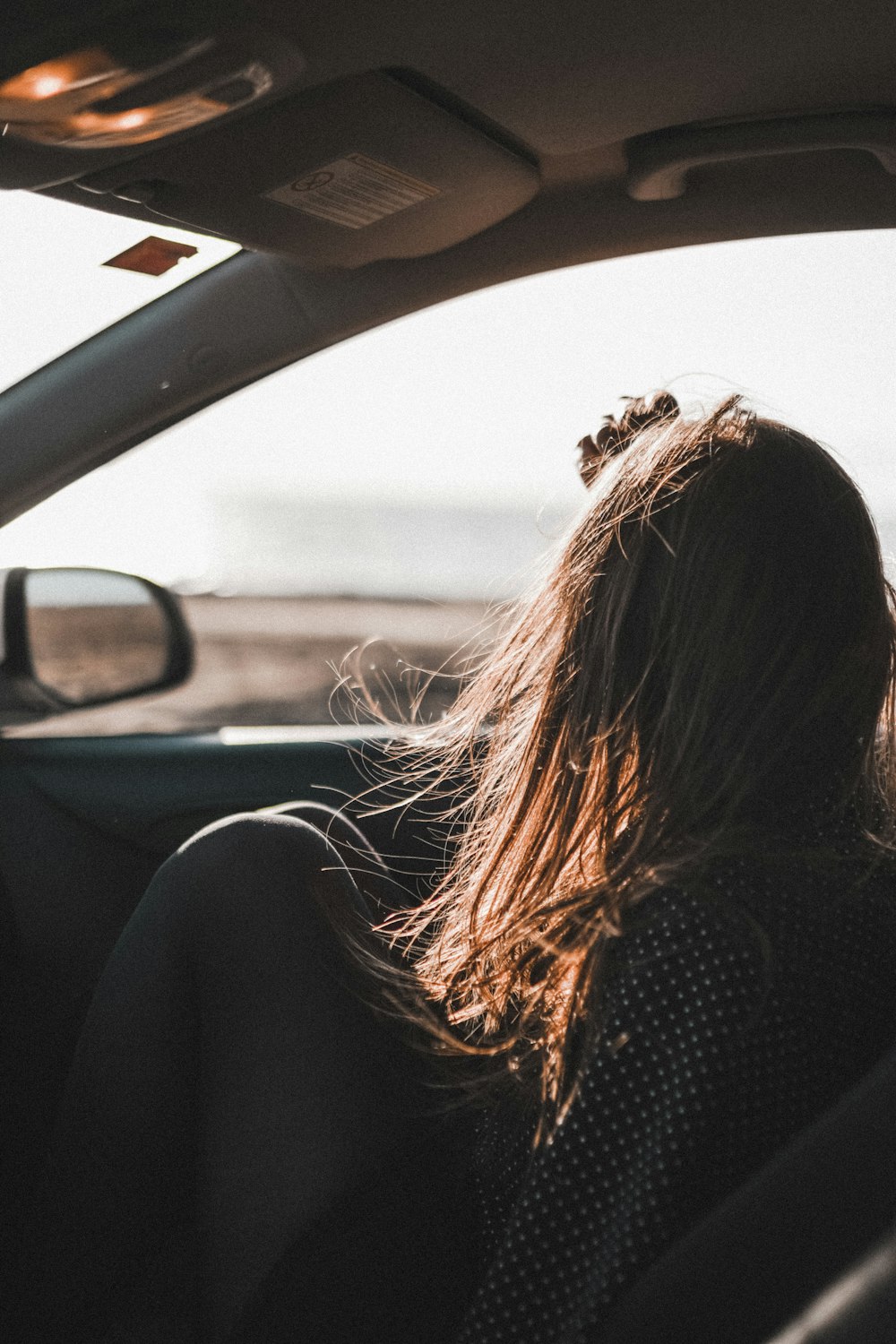 girl sitting in vehicle